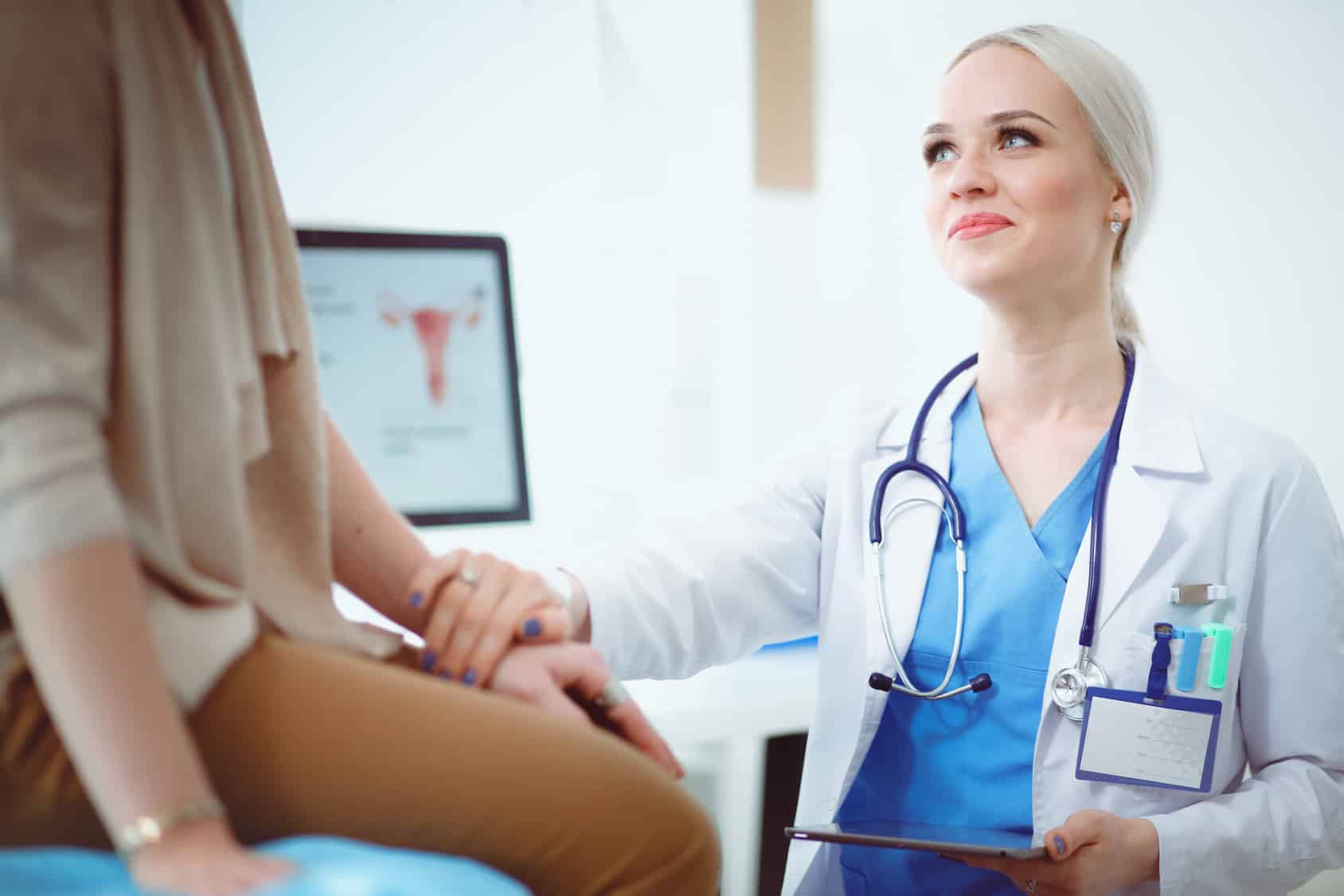 Doctor and patient discussing something while sitting at the table . Medicine and health care concept. Doctor and patient